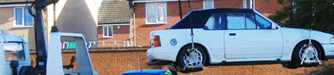A car being towed away.