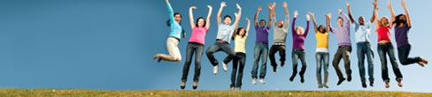 A diverse group of people, jumping in the air.