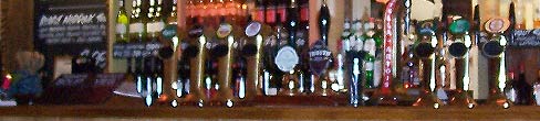 A row of pumps on a pub bar
