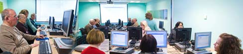 A group of people in a room using computers